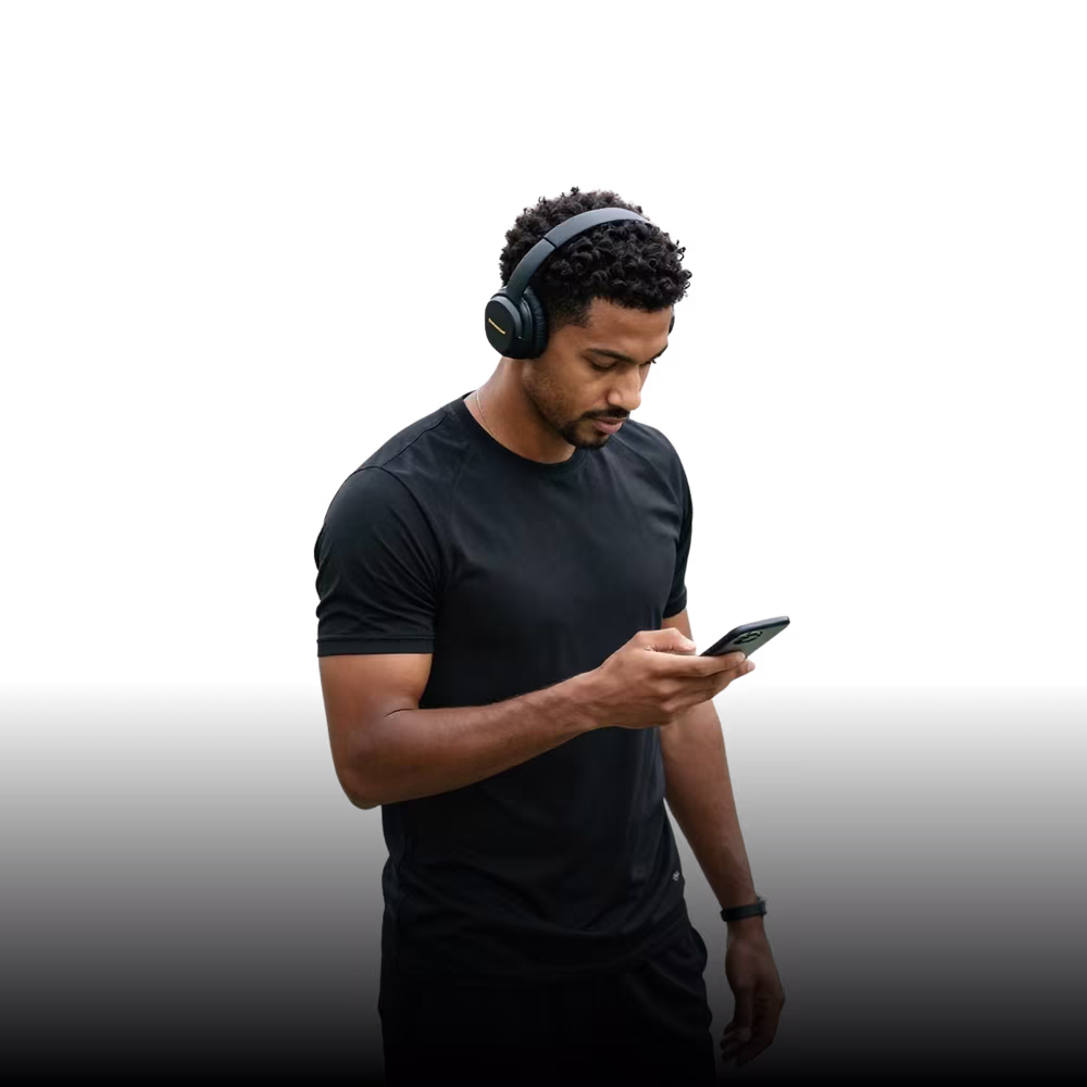 Male athlete looking at phone for training feedback